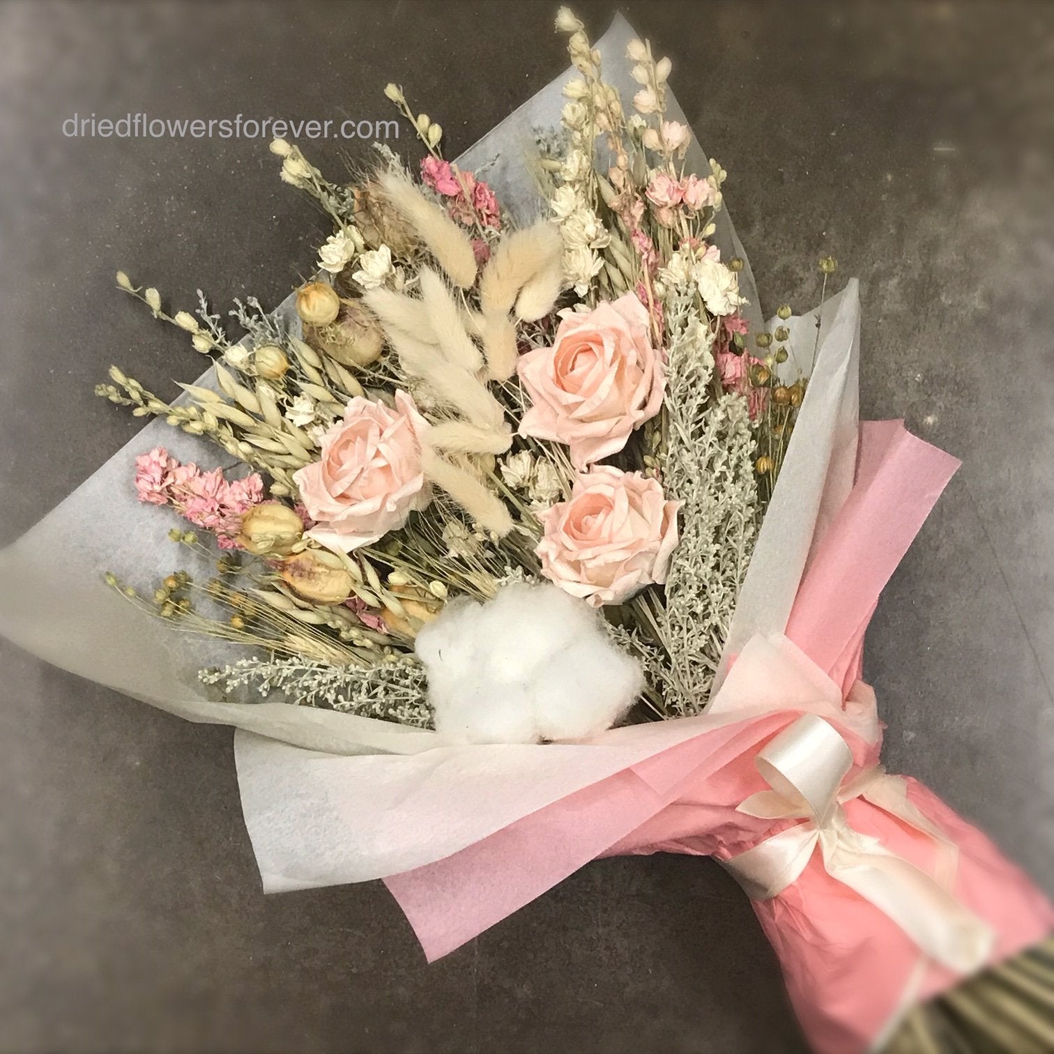 Dried pink flowers in paper