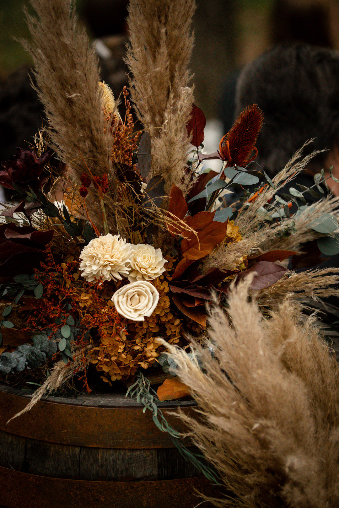 wiskey barrel dried flower arrangement
