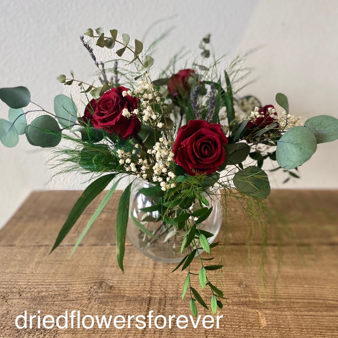 Preserved real red roses and eucalyptus arrangement