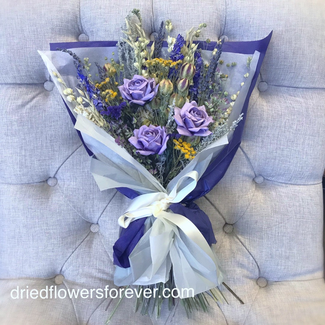 Purple dried flower gift bouquet with lavender roses